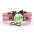 Bracciale in pelle intrecciata multistrato rosa con ciondolo quadrifoglio portafortuna. - Stile 11 / Rosa
