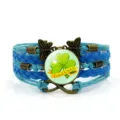 Bracciale in pelle intrecciata multistrato con ciondolo a trifoglio e design portafortuna. - Modello 4 / Blu