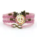 Bracciale in pelle intrecciata rosa con ciondolo segno di pace floreale e accessori farfalla vintage. - Rosa-Stile 1