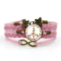 Bracciale in pelle intrecciata multistrato rosa con ciondolo in vetro simbolo pace fiori e farfalle. - Rosa Stile 6
