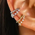 Detailed view of gold and silver zircon ear cuffs worn on the ear cartilage without piercing. - Vintage Hollow Rhinestone Stacking Style (35)