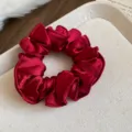 Red satin hair scrunchie closeup, elegant silk elastic hair band for women and girls daily styling. - Hair Tie - Red Flower