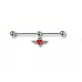 Industrial barbell piercing detail featuring a striking winged red crystal heart pendant. - Red Heart