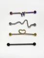 Details of four stainless steel industrial barbell piercing jewelry pieces showing diverse designs. - Style 8 / Set of 4
