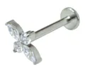 Detailed closeup of a titanium flower labret piercing jewelry featuring sparkling cubic zirconia. - Geometric Flower Style