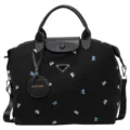Black nylon travel duffel bag large capacity weekend tote bag with leather handles and bow prints. - Black