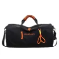 Black gym duffel bag with vibrant orange paracord handles for sports and travel use. - Black