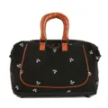 Black travel duffel bag with bow print and brown leather handles for gym and weekend trips. - Tan