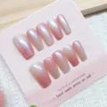 Uñas postizas hechas a mano con efecto ojo de gato rosa, set de uñas de ataúd largas. - Hielo de Flor de Durazno