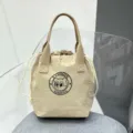 Waterproof canvas drawstring lunch bag, portable bucket handbag, casual commuter bento bag. - Khaki
