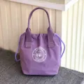 Paarse waterdichte canvas lunchtassendrager met trekkoordsluiting en schattig logobadge. - Paars