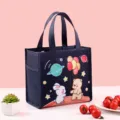 Insulated lunch bag for students and office workers, waterproof bento handbag with cute cartoon print. - Bear and Rabbit