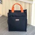 Black multi-layer canvas tote bag with bright orange handle for daily commute and student use. - 808 Black Tag
