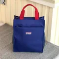 Blue multi-layer thickened student tote bag with red handles and convenient mesh side pockets. - 808 Blue Tag