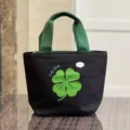 Black canvas lunch bag with green handle, minimalist bento tote bag for office daily use. - Lucky Clover / Black