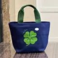Canvas lunch bag with green clover print, minimalist Japanese style bento handbag for daily use. - Lucky Clover / Dark Blue
