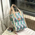 Insulated lunch bag with cute cartoon rabbit pattern, waterproof bento tote for work. - Colorful Cute Rabbit