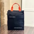 Zwarte nylontas met oranje handvatten, meerlagige werktas en handtas voor studenten en woon-werk. - 808 Zwarte letters