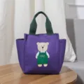 Paarse canvas lunchtas voor dames, leuke tas met berenprint en groene handvatten. - Paars