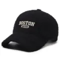 Detail view of black teddy fleece baseball cap featuring white Boston 1630 embroidery. - Adjustable / Black