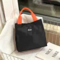 Zwarte lunchtas met oranje handvatten, grote draagbare geïsoleerde tas voor het werk. - Zwart