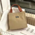 Minimalistische canvas lunchhandtas, casual grote capaciteit tote bag in kaki met bruine handvatten. - Khaki