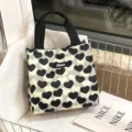 Canvas lunch tote bag with black and white heart pattern, casual daily handbag for women. - Black And White Heart