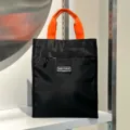 Black tote lunch bag with orange handles, front zipper pocket and stylish contrast design. - With Cup Holder / Black