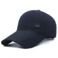 Dark blue baseball cap with extended brim and metallic M logo, casual outdoor sun protection. - M Logo / Navy Blue