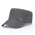 Close-up detail of the breathable mesh side holes and metal sports logo on the tactical cap. - Adjustable / Dark Gray