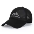 Detailed view of black mesh baseball cap with mountain embroidery and breathable fabric. - Adjustable / Black