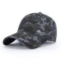 Close-up detail of the vintage camo baseball cap showing the custom metal mountain badge. - Navy Blue