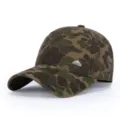 Camo baseball cap detail showing retro metal badge and durable canvas fabric construction - Light Yellow