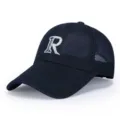 Detailed view of the breathable navy blue mesh baseball cap with white embroidered letter R. - Adjustable / Blue