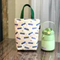 Canvas lunchtas met groene handvatten en leuke gedrukte patronen, duurzame tas. - Beige Letters