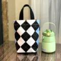 Canvas handbag featuring blue and black argyle pattern, stylish casual mini tote bag. - Black and White Diamond Grid