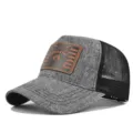 Grey mesh baseball cap with a distinctive brown leather raccoon patch on the front. - Adjustable / Heather Gray Black Mesh