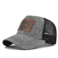 Grey mesh trucker hat featuring brown leather patch, perfect for outdoor fishing and daily wear. - Adjustable / CM817-7 Heather Gray with Black Mesh