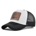 Classic black and white mesh trucker hat with brown leather hunting patch detail. - Adjustable / CM816-18 Black & White