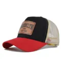 Detailed view of the red and black mesh baseball cap with a Brooklyn leather patch for summer. - Red & Black (Beige Mesh)