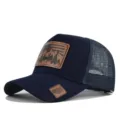 Detailed view of dark blue trucker hat with leather patch, breathable mesh design. - Adjustable / Navy Blue (CM802-3)