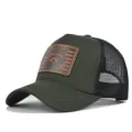 Detail view of the dark green trucker hat featuring a stylish brown leather raccoon patch and mesh. - Adjustable / Army Green with Black Mesh