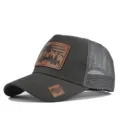 Detail view of dark grey trucker hat with mesh back and hunting deer leather patch. - Adjustable / Dark Gray (CM802-5)