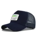 Navy blue mesh trucker hat with embroidered fish patch and curved brim for summer. - Adjustable / Navy Blue