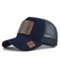 Donkerblauwe trucker cap met leren patch, ademende mesh achterkant en verstelbare snap. - Verstelbaar / CM806-3 marineblauw / Marineblauw