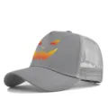 Grey trucker hat detail showing Halloween pumpkin evil face print and breathable mesh design. - Light Gray