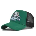 Detail view of the green mesh trucker cap featuring front embroidery and breathable back. - Adjustable / Green (CP713-8)