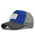 Detail shot of the blue and grey mesh trucker hat with embroidered fish logo patch. - Adjustable / Dark Grey/Blue