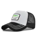 Classic black and white trucker hat with mesh back, embroidered fish patch and curved brim. - Adjustable / Black and White Embroidery Thread