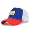 Close-up detail of the trucker hat front patch, featuring embroidered fish logo and contrast brim. - Adjustable / CM714-29 Red & Royal Blue with White Mesh
